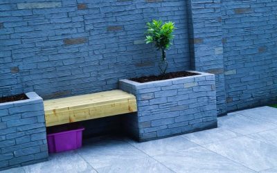 Small garden redesign with printed wall and porcelain paving